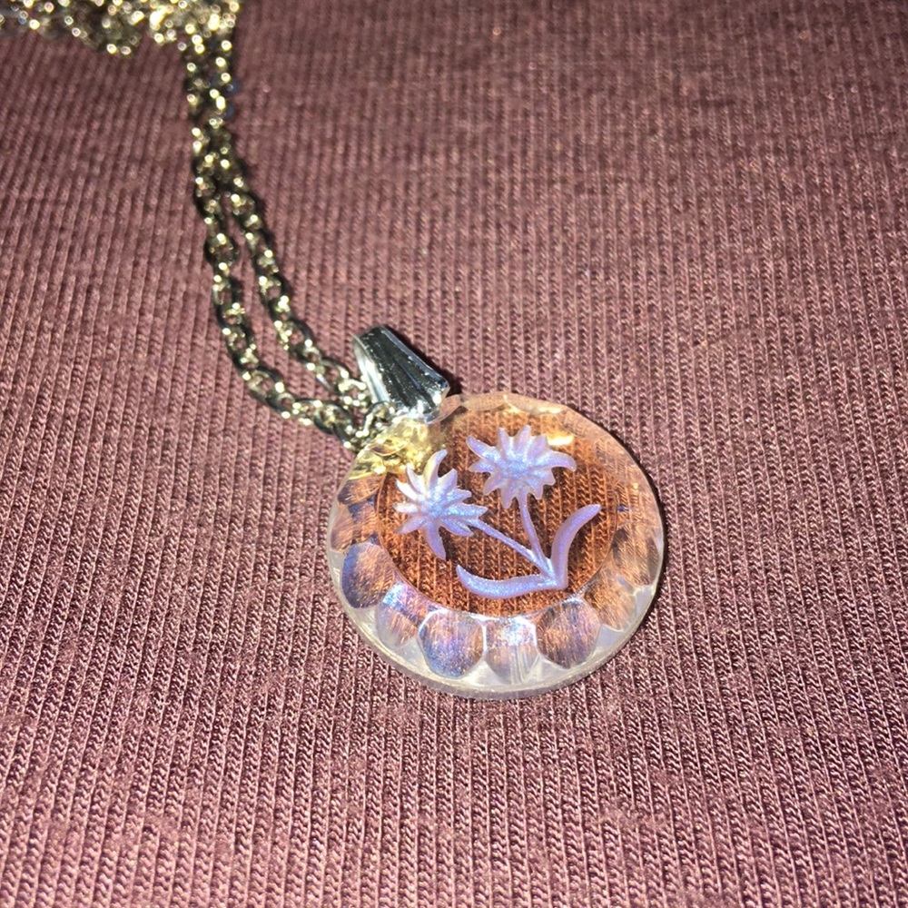 Necklace engraved with a flower